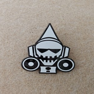 hard enamel skull pins with a pointed hat, sunglasses, and headphones