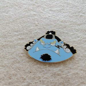 This is a  cartoonish guardian lion or foo dog design East Asian culture enamel pins